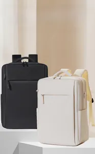 Detail showing high-capacity laptop backpack with water-resistant fabric in black and beige