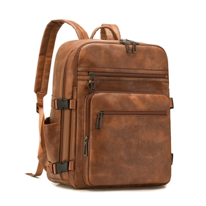 Women's brown faux leather business backpack featuring multiple zip pockets and padded straps