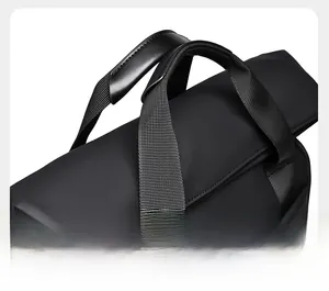 Detail of the black business backpack featuring a reinforced leather padded carry handle