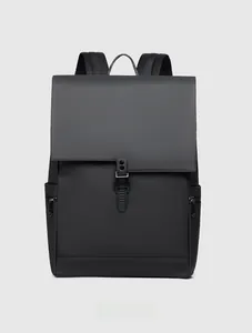 Front detail of matte black waterproof backpack with single buckle and flap closure