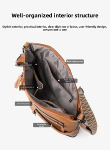 Detailed view of the brown leather shoulder bag interior with multiple storage compartments