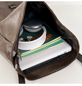 Top view of vintage PU leather backpack with a padded laptop compartment and spacious interior