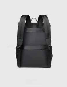 Rear view of black laptop backpack featuring padded straps and a luggage trolley strap
