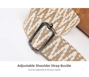 Detail of adjustable woven shoulder strap with metallic buckle for crossbody bag