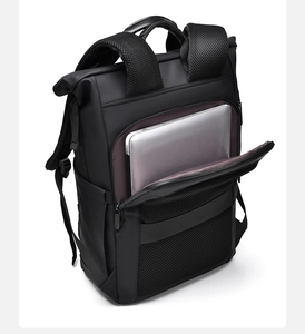Detail of ergonomic breathable mesh padding and laptop compartment on black business backpack