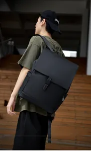 Detail of waterproof matte black backpack featuring secure buckle and side zipper