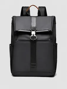 Detail view of water-resistant matte black business backpack with orange handle accents