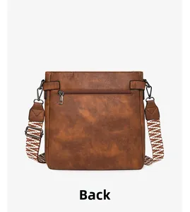 Back view of brown vintage messenger bag with wide patterned strap and zipper pocket