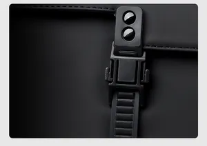 Detail of the industrial magnetic buckle on black backpack for quick and easy access
