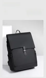 Detail of minimalist black waterproof backpack with matte texture and unique metal buckle