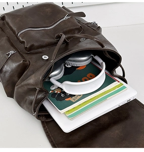 Deep brown vintage leather backpack with large capacity for laptop and travel essentials