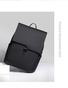 Detailed side view of matte black backpack with vertical zipper pockets and buckle flap