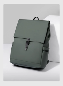 Detail of dark green waterproof backpack with matte finish and black buckle closure