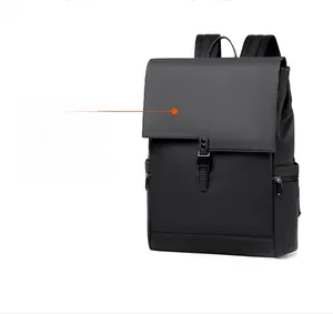 Detail of black waterproof backpack with matte finish, buckle flap, and side zipper pocket