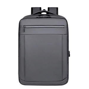 Close-up of gray business backpack featuring built-in USB charging port and sleek fabric