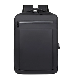 Detail view of black business laptop backpack showing the side USB charging port interface