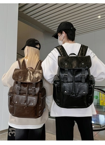 Detail view of retro PU leather backpack with vintage matte finish and buckle drawstring closure