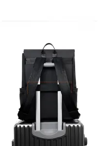 Business laptop backpack with back luggage strap for secure attachment to suitcase handles