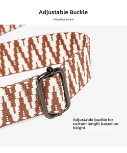 Detail of adjustable woven bag strap with geometric patterns and black metal buckle