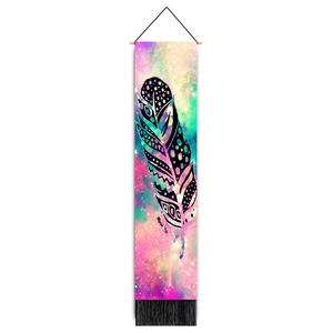 Detailed view of colorful nebula wall tapestry with ethnic feather design and black tassels