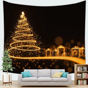Detail of Christmas tapestry featuring a golden spiraling tree on a soft black fabric