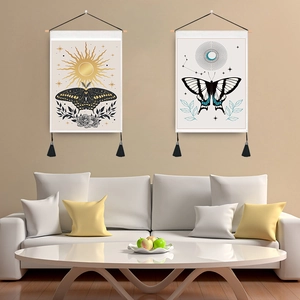 Minimalist sun and butterfly wall tapestries with tassels in a modern living room
