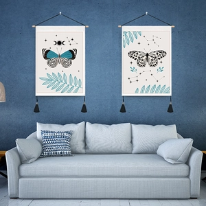 Set of two vintage butterfly and moon celestial tapestries with wooden poles and tassels
