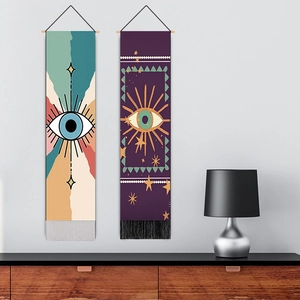Bohemian Evil Eye wall tapestry with colorful geometric patterns and elegant black and white tassels