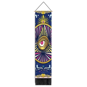 Vertical wall tapestry featuring evil eye design with blue background and black tassels