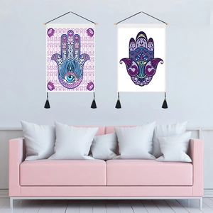 Hamsa hand wall tapestries with tassels for home decor in a modern living room setting