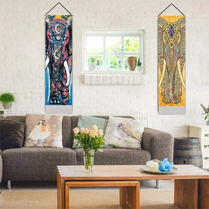 Modern living room wall decor featuring vibrant Indian elephant art tapestries on white brick