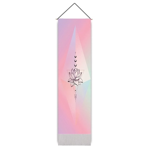 Close-up of bohemian lotus tapestry with light wood hanging rod and black cord