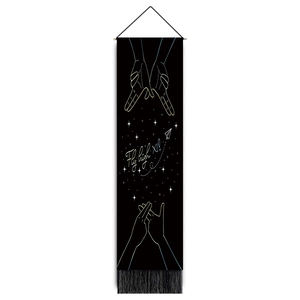 Vertical minimalist line art wall hanging with black tassels and Fly High X1 print