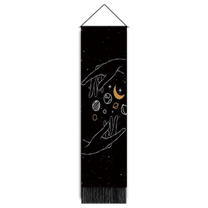 Detail of minimalist moon and stars wall tapestry with elegant black fringe trim