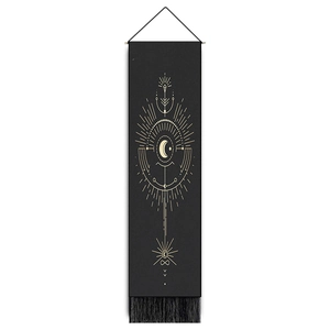 Boho wall hanging with black tapestry, golden sun moon prints and elegant tassels