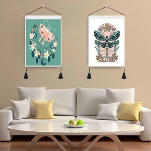 Vintage moth and dragonfly wall tapestries with tassels in a modern living room setting