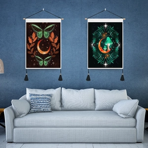 Detail of mystic moth and mushroom tapestries with wooden poles and black tassels