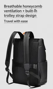 Detail of breathable mesh back panel and luggage strap on black business backpack