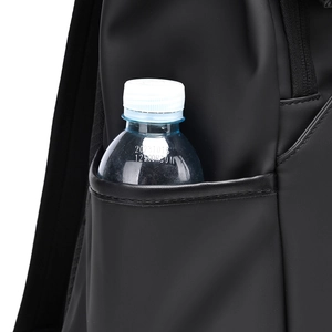 Detail of the side pocket on a black business backpack holding a water bottle