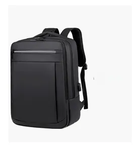 Detailed side view of black business backpack showing built-in USB charging port and pocket