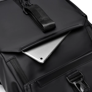Detail of minimalist black laptop backpack with tablet compartment and secure buckle closure