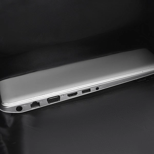 Detail of internal laptop compartment with padded lining for silver notebook storage