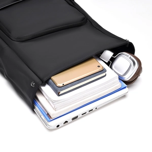 Top view showing spacious interior of black business backpack with laptop storage