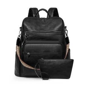 Black pebbled leather backpack set with matching clutch and ethnic woven strap