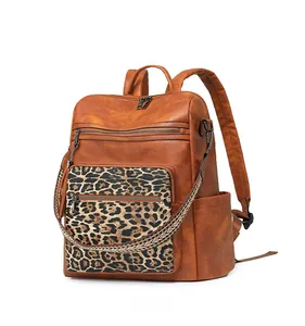Side view of leopard print backpack with multiple zip pockets and adjustable straps