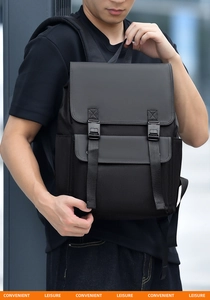Detail of waterproof black business backpack with mixed fabric textures and side water bottle pocket