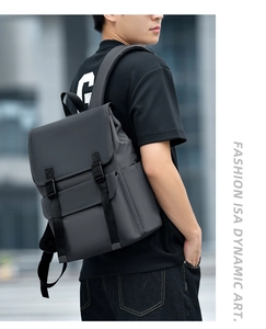 Water-resistant dark grey business backpack with flap cover and buckle straps detail