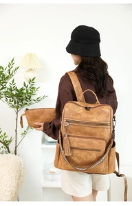 Fashionable leopard print backpack and clutch set with ethnic strap shown in lifestyle setting