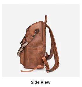 Side view of brown PU leather backpack with ethnic woven strap and metal hardware
