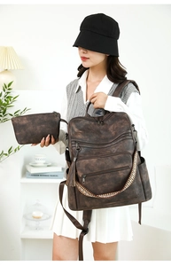 Detail of vintage leopard print backpack with matching pouch and woven handle texture